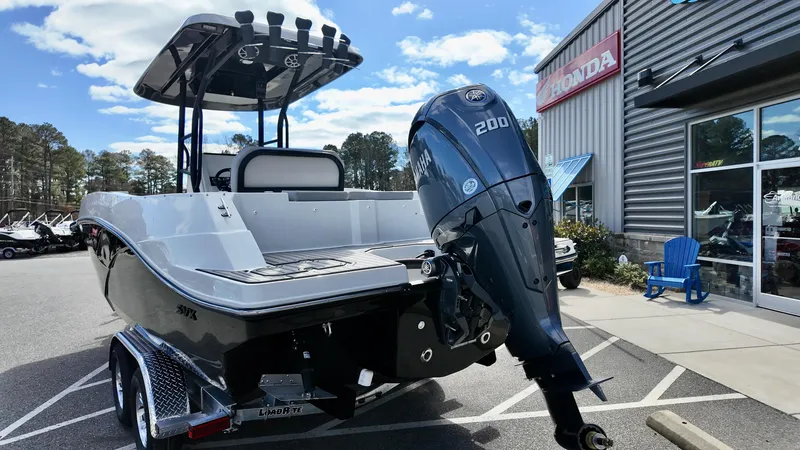 Slide: The Image of 2025 Starcraft SVX 231 OB boat with Yamaha 200 engine, parked outside dealership. - 5