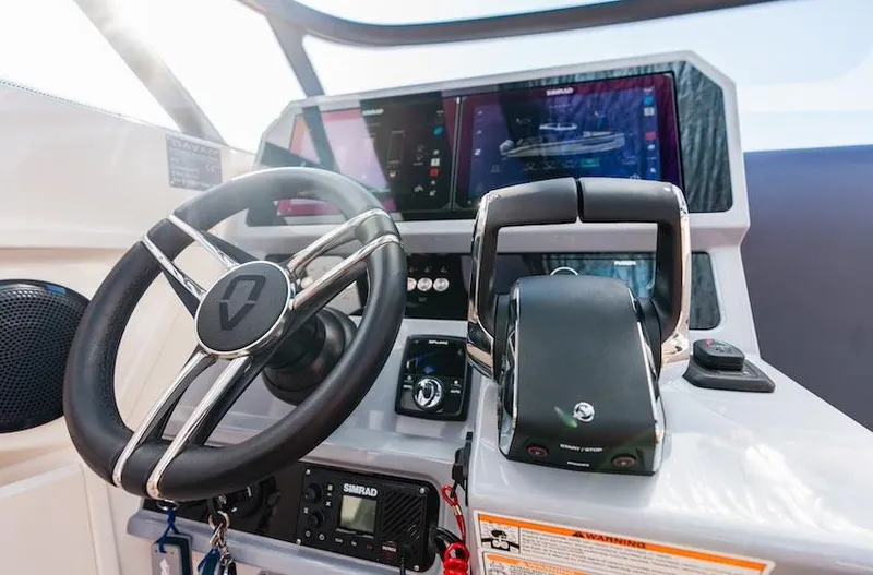 Slide: The Image of Cockpit of 2025 Navan S30 boat with modern steering and navigation controls. - 12