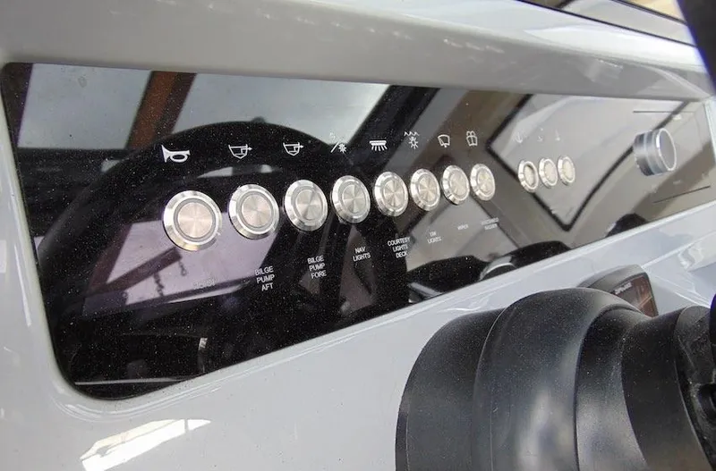 Slide: The Image of Control panel of 2025 Navan S30 boat with labeled buttons and switches. - 14