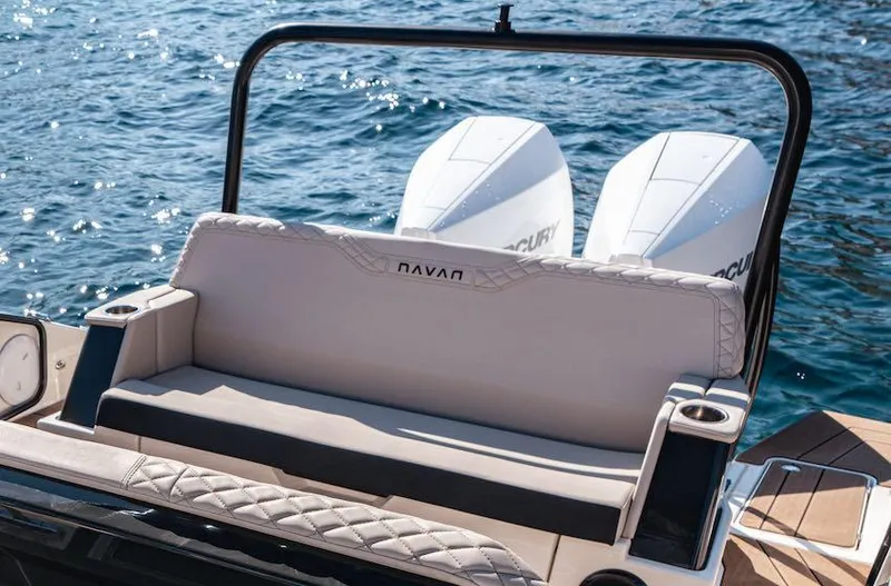 Slide: The Image of 2025 Navan S30 boat with dual engines and cushioned seating on the water. - 6