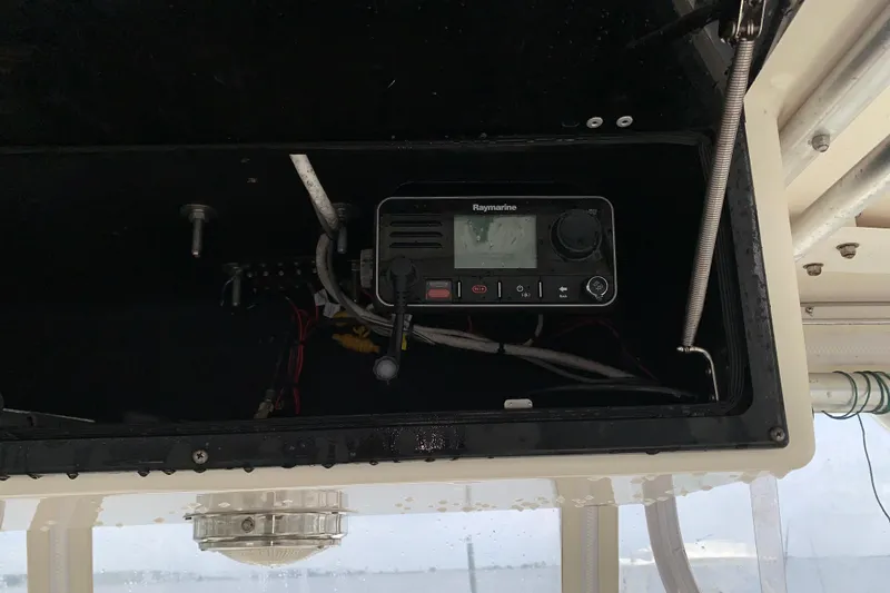 Slide: The Image of Radio equipment inside a 2001 Carolina Classic 28 boat compartment. - 10