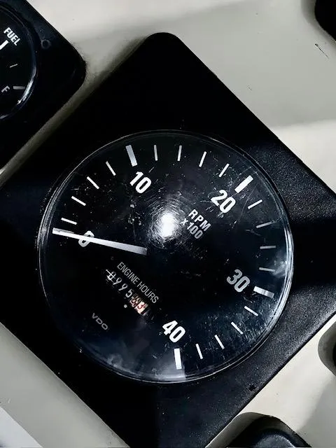 Slide: The Image of Close-up of a 2001 Carolina Classic 28 RPM gauge displaying engine hours. - 12