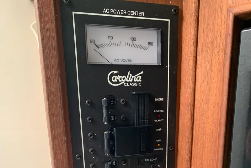 Slide: The Image of AC power center panel of 2001 Carolina Classic 28 boat. - 22