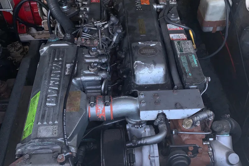 Slide: The Image of Engine of a 2001 Carolina Classic 28 boat, showcasing detailed mechanical components. - 24