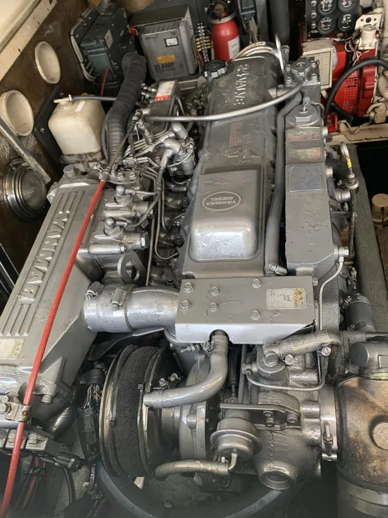 Slide: The Image of Engine of a 2001 Carolina Classic 28 boat, showcasing detailed mechanical components. - 25