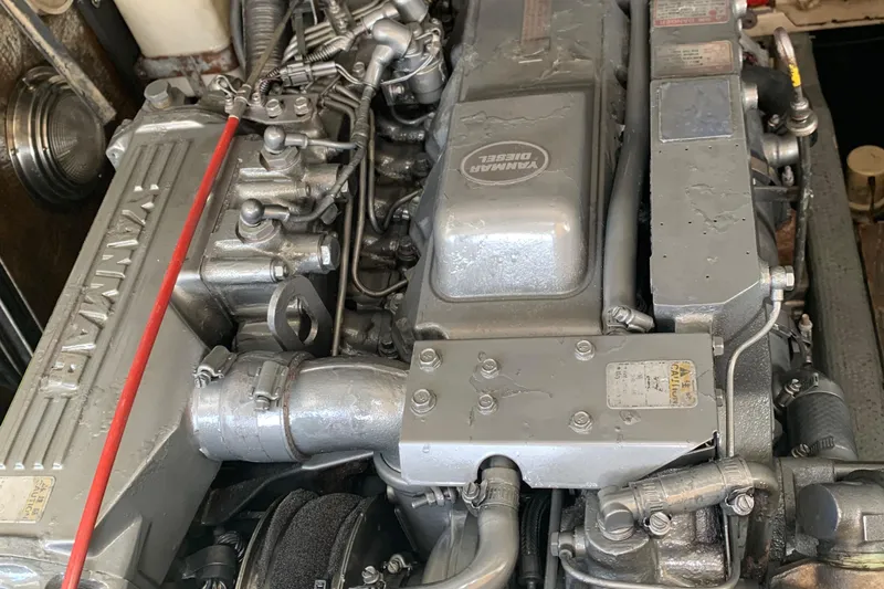 Slide: The Image of Engine of a 2001 Carolina Classic 28 boat, showcasing detailed mechanical components. - 26