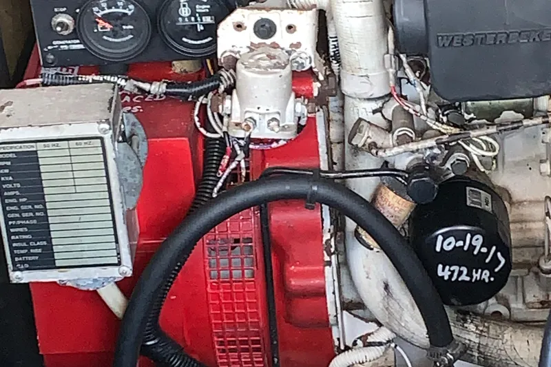 Slide: The Image of Engine compartment of a 2001 Carolina Classic 28 boat, showing gauges and components. - 27