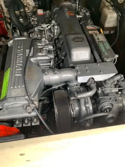 Slide: The Image of Engine of a 2001 Carolina Classic 28 boat, showcasing detailed mechanical components. - 28