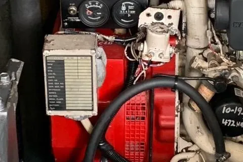 Slide: The Image of Engine compartment of a 2001 Carolina Classic 28 boat, featuring gauges and wiring. - 29