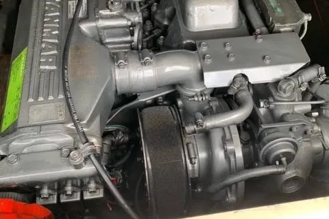 Slide: The Image of Engine of a 2001 Carolina Classic 28 boat, showcasing mechanical components. - 30