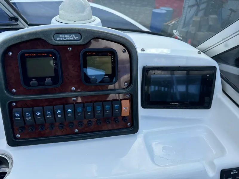 Slide: The Image of Control panel of 2014 Sea Hunt Escape 235 SE boat with navigation instruments. - 5