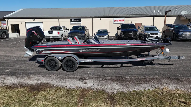 Slide: The Image of 2025 Phoenix 921 ELITE boat on trailer, parked in dealership lot. - 12