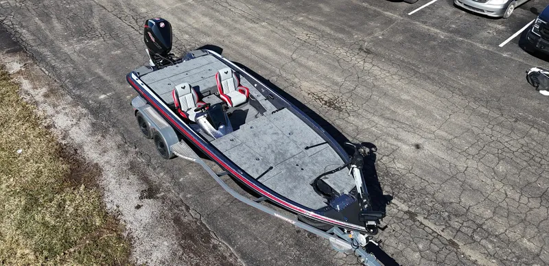Slide: The Image of 2025 Phoenix 921 ELITE boat on trailer, parked on asphalt. - 13