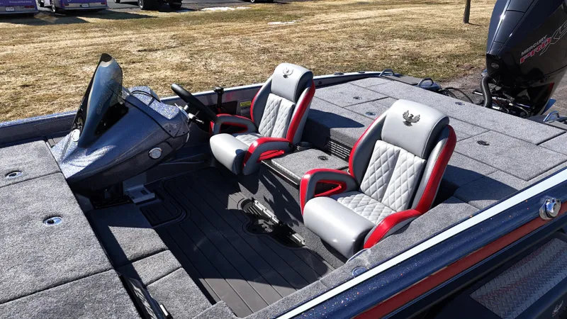 Slide: The Image of 2025 Phoenix 921 ELITE boat interior with dual seats and steering console. - 18