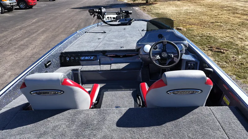 Slide: The Image of 2025 Phoenix 921 ELITE boat interior with dual seats and steering console. - 4