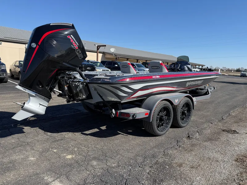 Slide: The Image of 2025 Phoenix 921 ELITE bass boat with powerful outboard motor on trailer. - 7