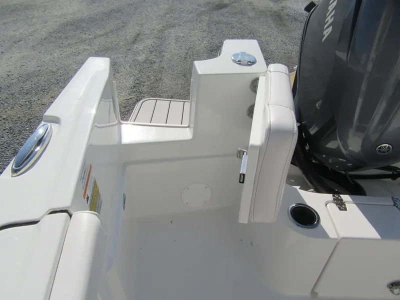 Slide: The Image of Parker 2400 Center Console 2025 boat interior with seating and engine view. - 11
