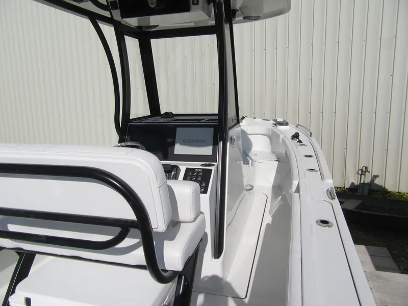 Slide: The Image of 2025 Parker 2400 Center Console boat interior with modern controls and seating. - 12