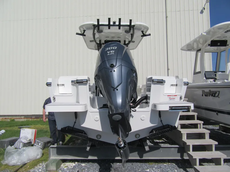 Slide: The Image of 2025 Parker 2400 Center Console boat with powerful 300 V6 engine, displayed outdoors. - 17