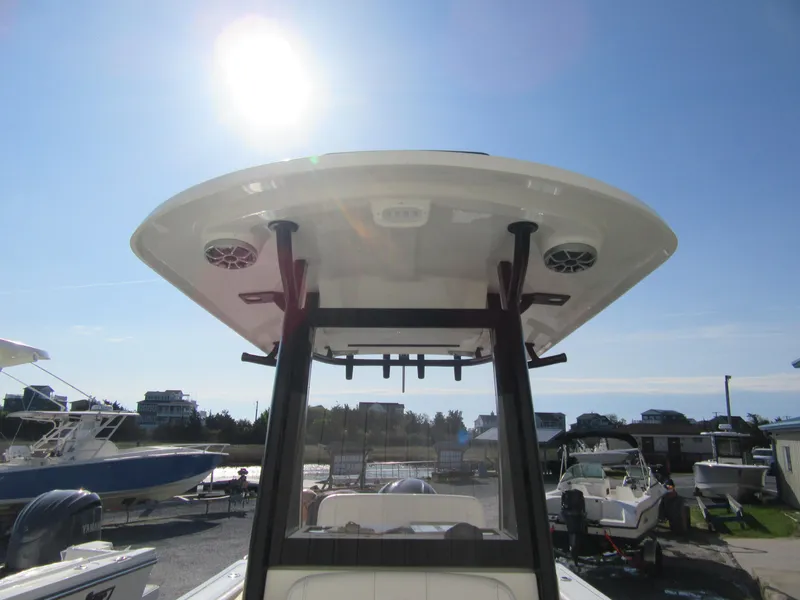 Slide: The Image of 2025 Parker 2400 Center Console boat under sunny sky at marina. - 6