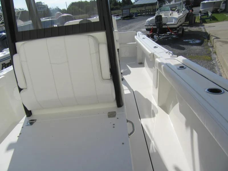 Slide: The Image of 2025 Parker 2400 Center Console boat interior with white seating and deck. - 7