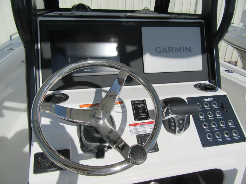 Slide: The Image of 2025 Parker 2400 Center Console boat dashboard with Garmin navigation system. - 9