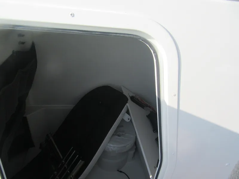Slide: The Image of Interior view of 2025 Parker 2900 Center Console boat storage compartment. - 12