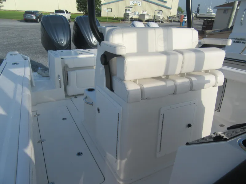 Slide: The Image of 2025 Parker 2900 Center Console boat interior with dual engines and cushioned seating. - 22