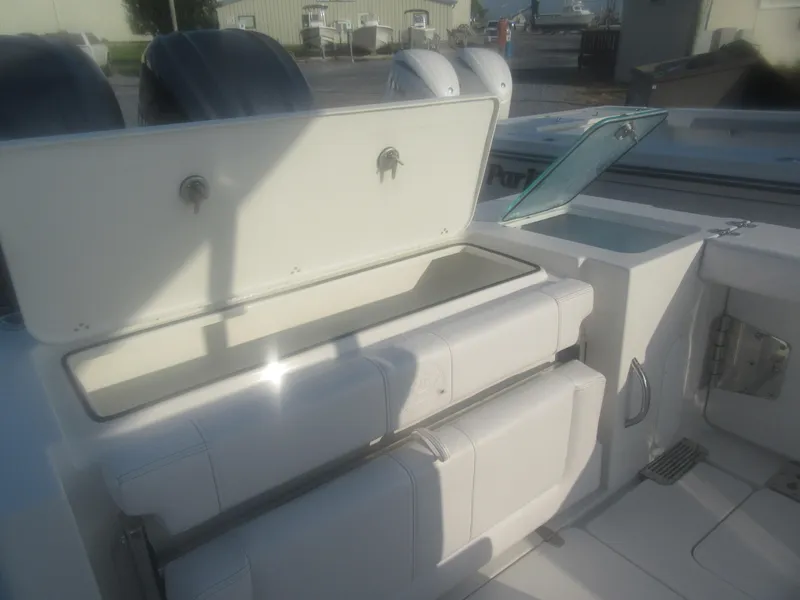 Slide: The Image of 2025 Parker 2900 Center Console boat interior with open storage compartments. - 4