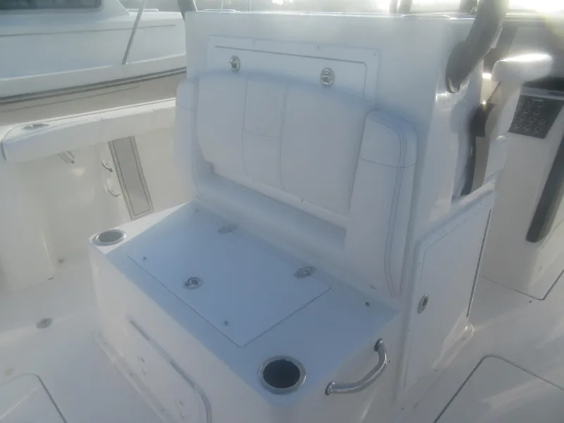 Slide: The Image of 2025 Parker 2900 Center Console boat interior with white seating and storage compartments. - 6