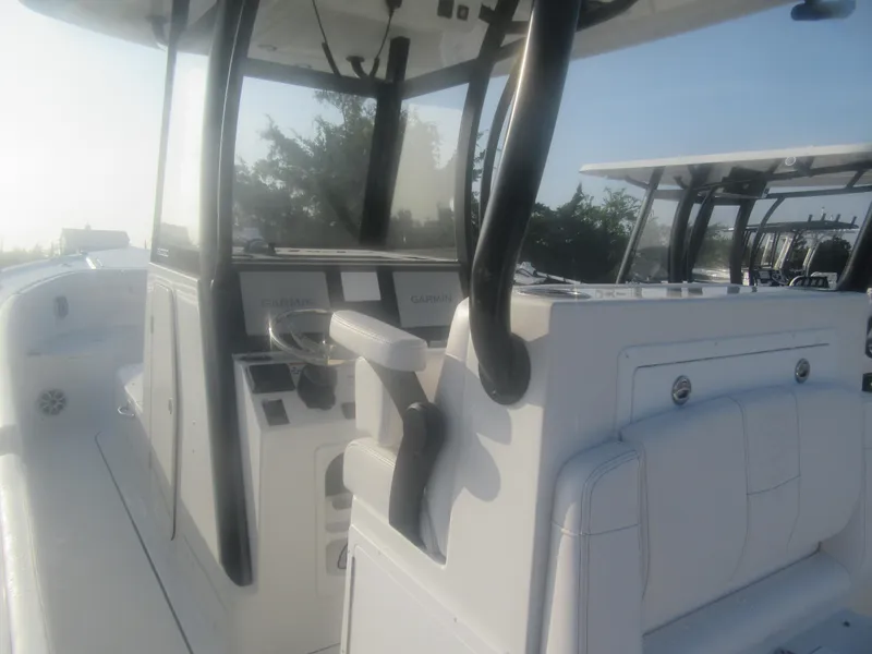 Slide: The Image of 2025 Parker 2900 Center Console boat with modern helm and seating. - 8