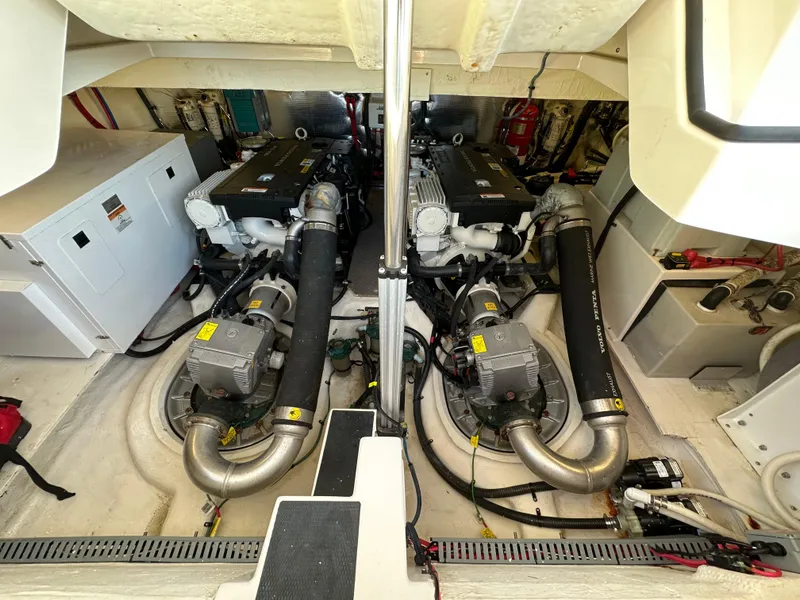 Slide: The Image of Engine room of a 2017 Regal 42 Sport Coupe with dual engines and equipment. - 18