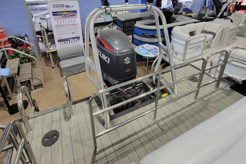 Slide: The Image of 2022 Bentley Pontoons Elite 253 Swingback with Suzuki outboard motor in showroom. - 8