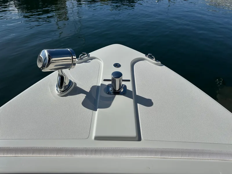 Slide: The Image of Bow of 2021 Duffy Bay Island boat with chrome fittings on calm water. - 5