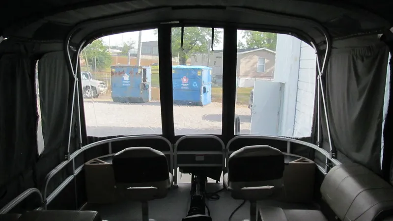 Slide: The Image of Interior view of 2018 Sun Tracker Fishin' Barge 22 XP3 pontoon boat with seating and windows. - 11