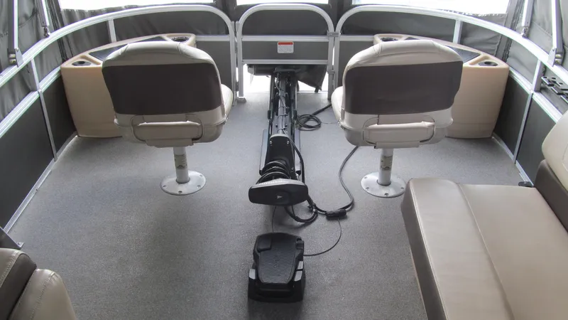 Slide: The Image of 2018 Sun Tracker Fishin' Barge 22 XP3 interior with seating and fishing equipment. - 12