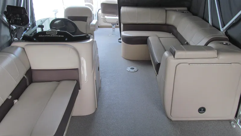 Slide: The Image of 2018 Sun Tracker Fishin' Barge 22 XP3 interior with spacious seating and modern helm. - 14