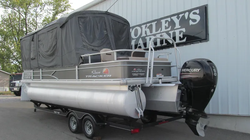 Slide: The Image of 2018 Sun Tracker Fishin' Barge 22 XP3 pontoon boat with Mercury outboard motor. - 2