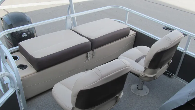 Slide: The Image of 2018 Sun Tracker Fishin' Barge 22 XP3 interior with cushioned seats and storage. - 4