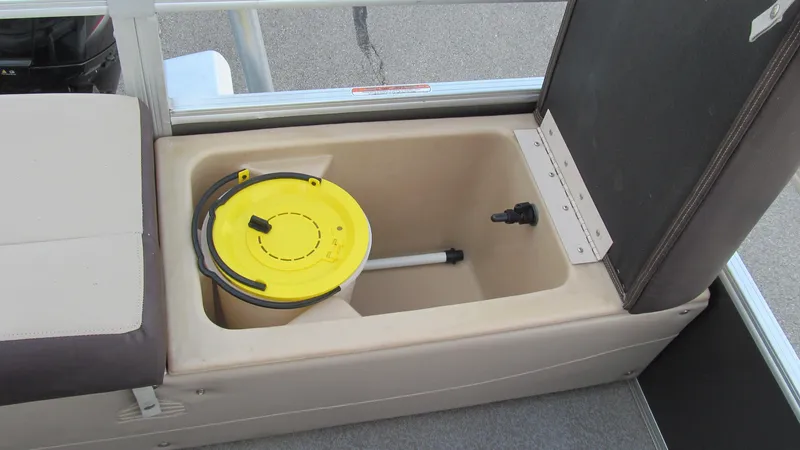 Slide: The Image of 2018 Sun Tracker Fishin' Barge 22 XP3 storage compartment with yellow-lidded container. - 5