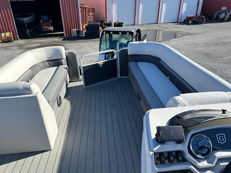 Slide: The Image of 2023 Godfrey SWEETWATER 2286 SFL pontoon boat interior with seating and control panel. - 7