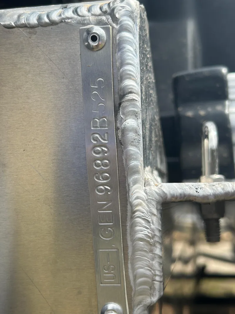 Slide: The Image of Close-up of a 2025 SunCatcher Select 322RC metal component with visible serial number. - 23