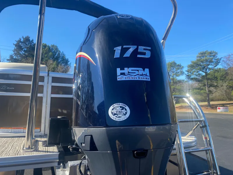 Slide: The Image of Outboard motor on 2025 SunCatcher Select 322RC pontoon boat, featuring 175 horsepower. - 4