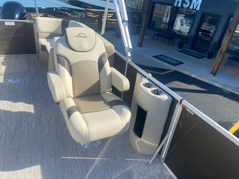 Slide: The Image of Luxurious seating on 2025 SunCatcher Select 322RC boat, featuring plush upholstery and cup holders. - 8
