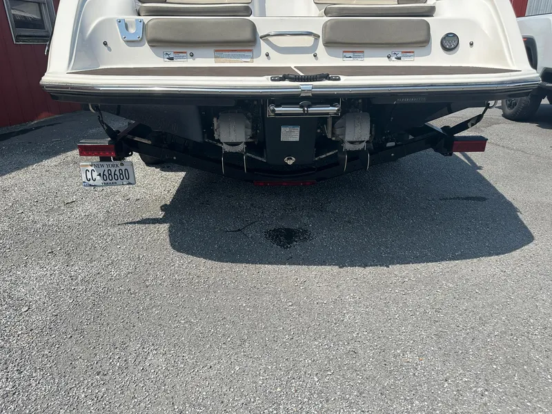 Slide: The Image of Rear view of a 2012 Yamaha Boats 242 Limited S on a trailer. - 11