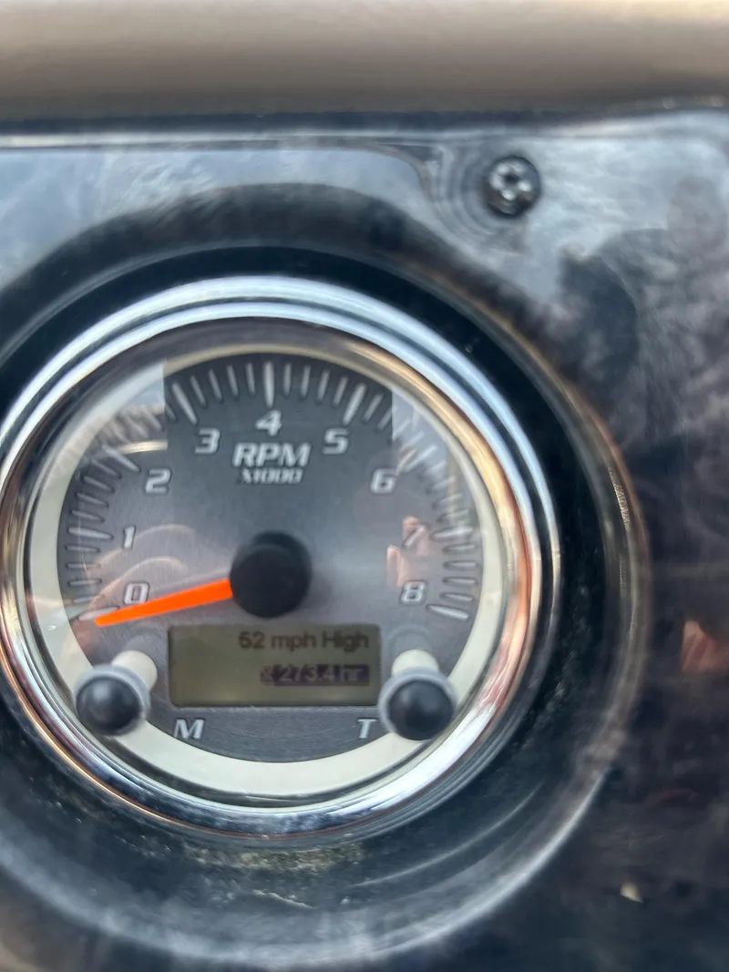 Slide: The Image of Close-up of 2012 Yamaha Boats 242 Limited S RPM gauge displaying 62 mph. - 13