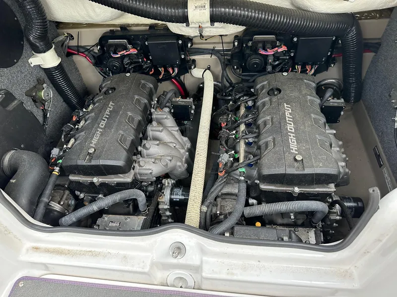 Slide: The Image of 2012 Yamaha Boats 242 Limited S engine compartment with dual high-output engines. - 15
