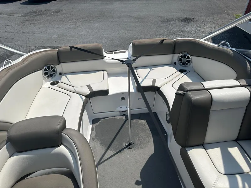 Slide: The Image of 2012 Yamaha Boats 242 Limited S interior with cushioned seating and speakers. - 7