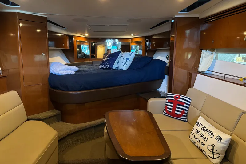 Slide: The Image of Luxurious interior of 2014 Sea Ray 350 Sundancer yacht with cozy seating and elegant decor. - 15