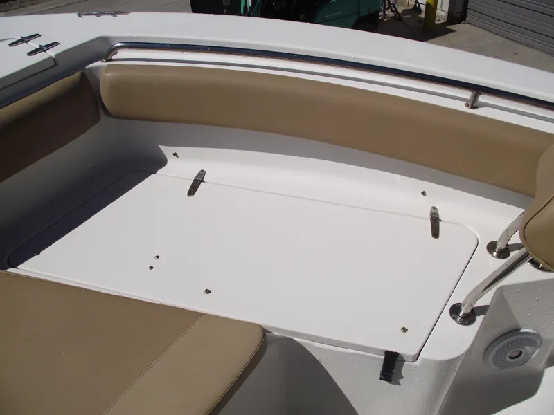 Slide: The Image of 2012 Sea Hunt Ultra 211 boat interior with beige seating and white deck. - 11